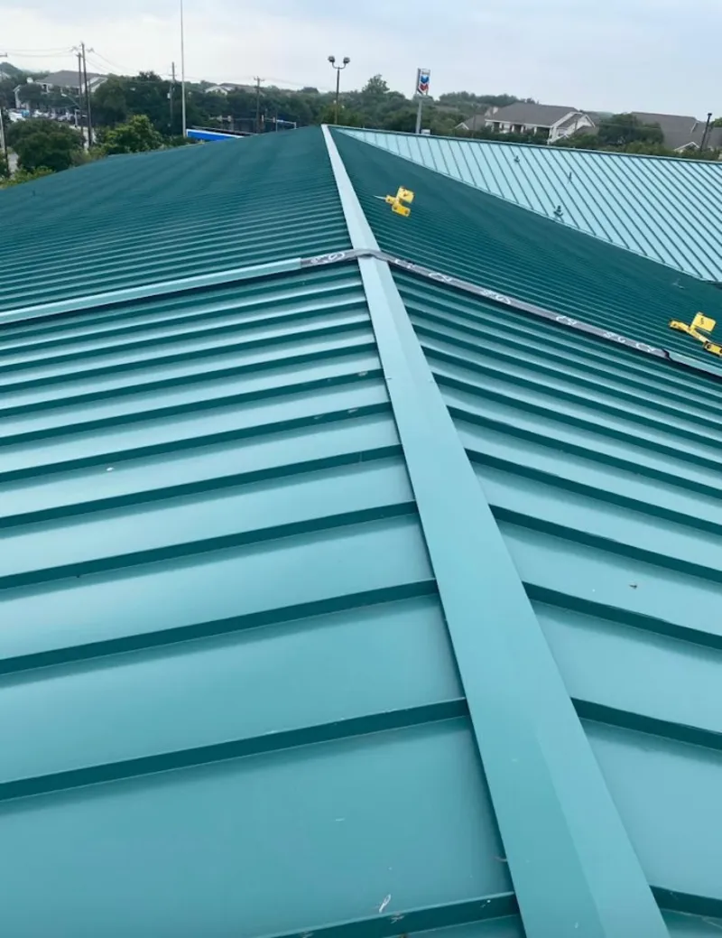 Green commercial metal roof ridge and valley for Metal Roof Repair in Moorhead